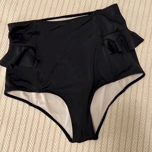 Black Kortni Jeane cheeky high waisted cheeky bottoms with side ruffle detail